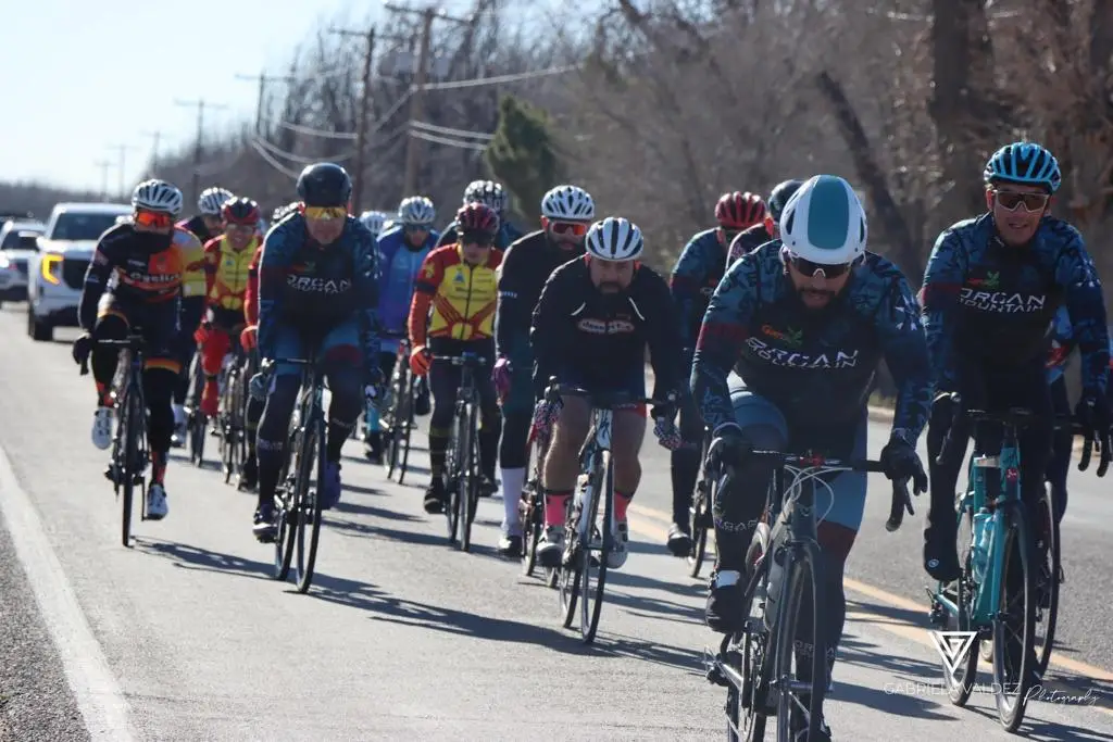 Organ Mountain Cycling 2 Group of cylists racing, this includes the team OMC, which Wolfies Creative Studios has a client.
